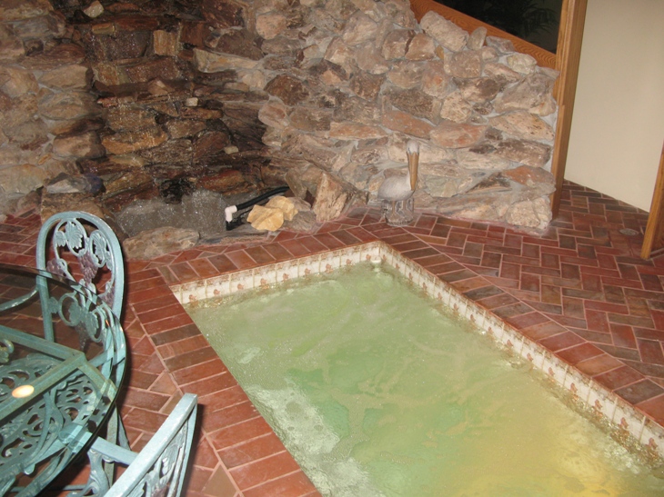 Spa with a waterfall in East Side Costa Mesa Home