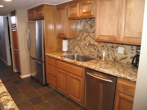 Kitchen with granite back splash