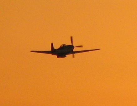 Plane flying away from Chino Airport
