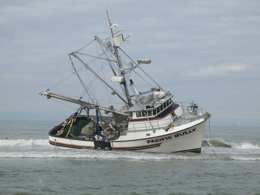 Boat beached and listing in Huntington Beach