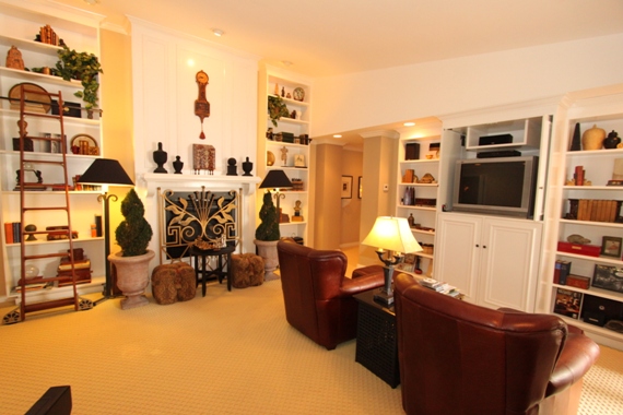 Granville home den with fireplace in Newport Beach